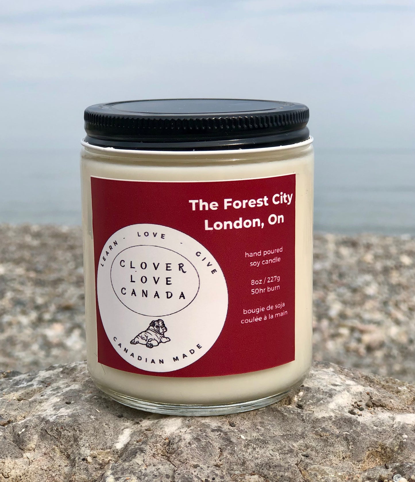 8 oz candle with red label The Forest City London  On